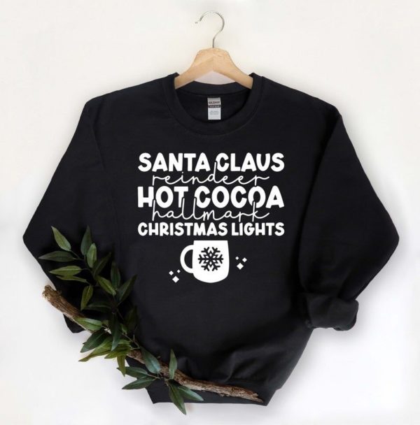 Santa Claus Reindeer Hot Cocoa Christmas Lights Christmas Sweatshirt Sweatshirt Black S
