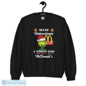 Santa Grinch Never Underestimate A Woman Who Works At Mcdonald’s Christmas Shirt - Unisex Crewneck Sweatshirt