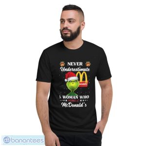 Santa Grinch Never Underestimate A Woman Who Works At Mcdonald’s Christmas Shirt - Short Sleeve T-Shirt