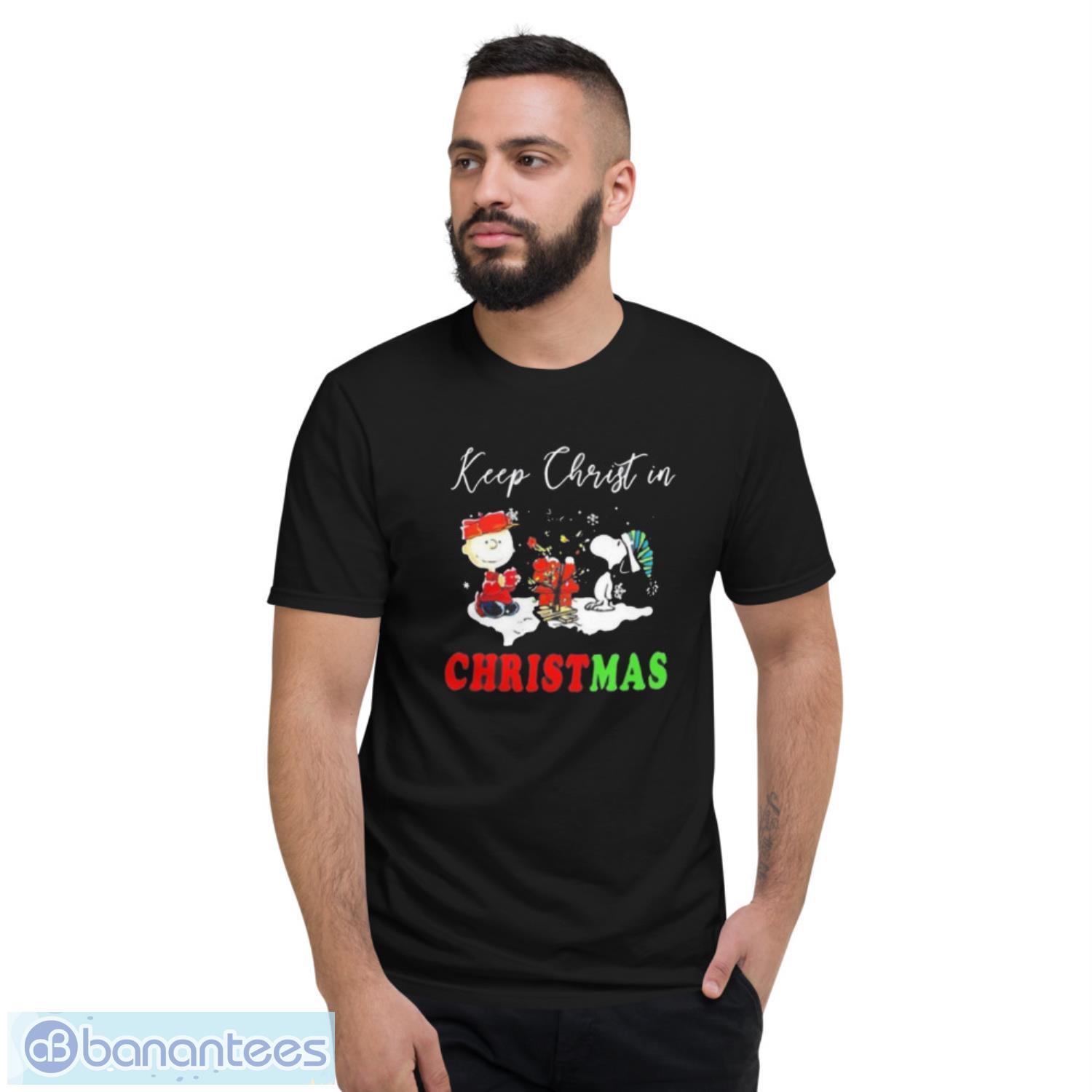 charlie-brown-snoopy-keep-christ-in-christmas-2022-sweater-1.jpeg Charlie Brown Snoopy Keep Christ In Christmas 2022 Sweater - Short Sleeve T-Shirt