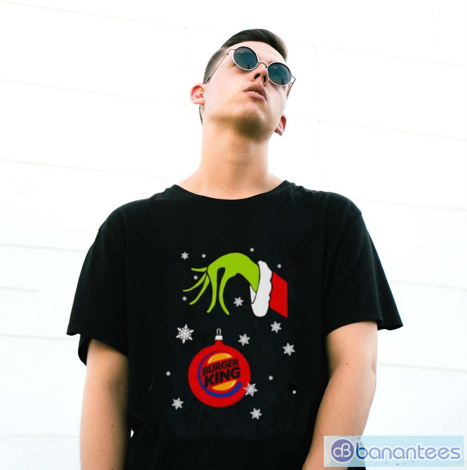 grinch hand holding ornament burger king snowflake christmas shirt 2 image Grinch Hand holding Ornament Burger King Snowflake Christmas shirt - G500 Gildan T-Shirt
