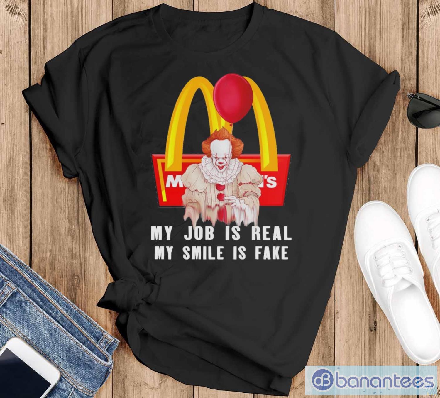 pennywise my job is real my smile is fake mcdonalds shirt image Pennywise My Job Is Real My Smile Is Fake McDonalds Shirt - Black T-Shirt