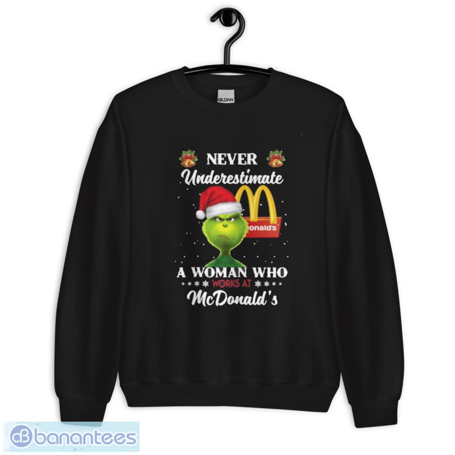 santa grinch never underestimate a woman who works at mcdonalds christmas shirt 2 image Santa Grinch Never Underestimate A Woman Who Works At Mcdonald’s Christmas Shirt - Unisex Crewneck Sweatshirt