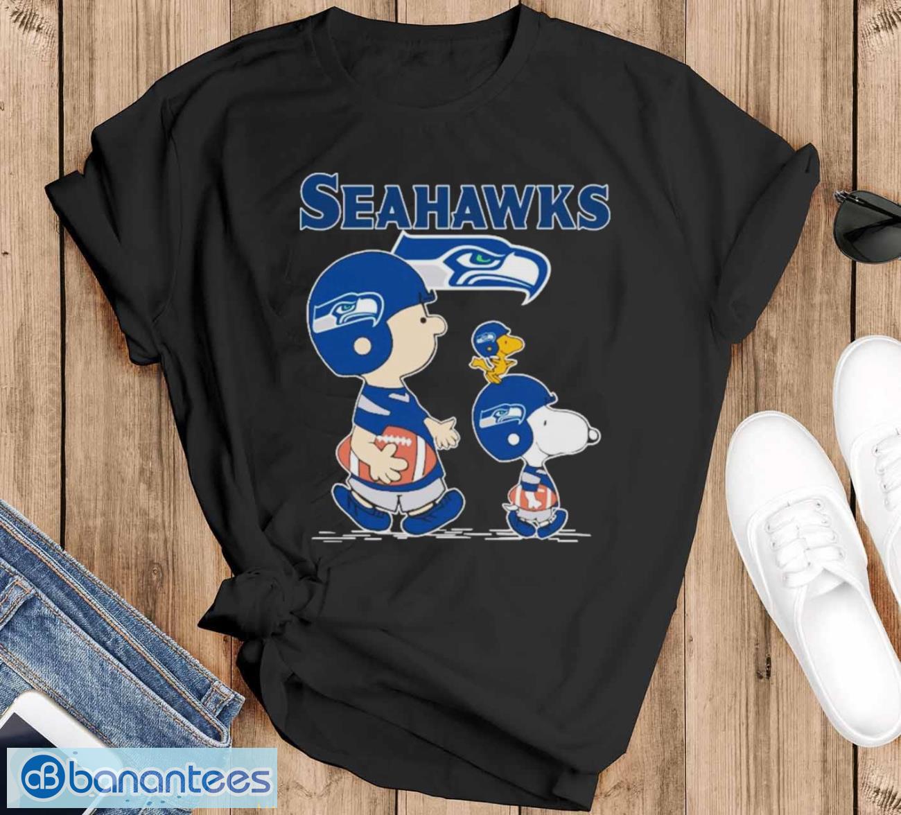 original seattle seahawks lets play football together snoopy charlie brown and woodstock shirt image Original seattle Seahawks Let’s Play Football Together Snoopy Charlie Brown And Woodstock Shirt - Black T-Shirt