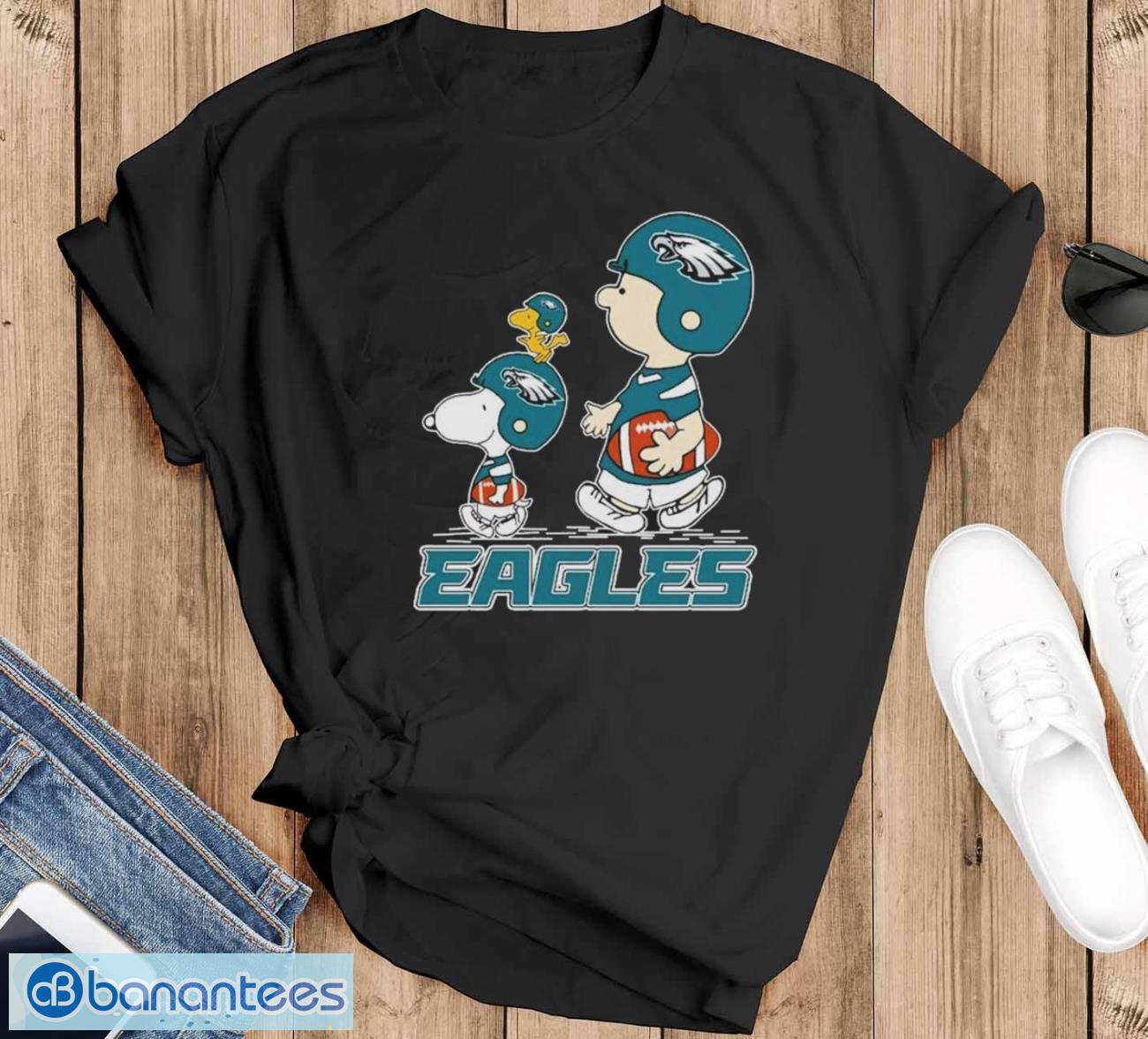 peanuts charlie brown snoopy and woodstock philadelphia eagles walking shirt image Peanuts Charlie Brown Snoopy And Woodstock Philadelphia Eagles Walking Shirt - Black T-Shirt