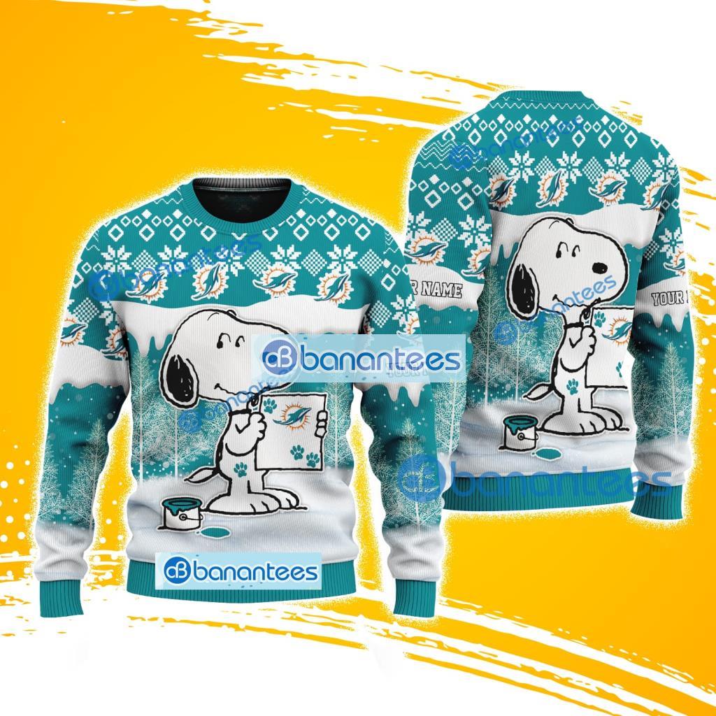 miami dolphins nfl snoopy happy custom name christmas ugly sweater new fashion image Miami Dolphins NFL Snoopy Happy Custom Name Christmas Ugly Sweater New Fashion Product Photo 1